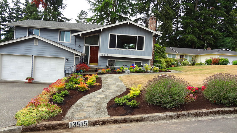 A wide, new pathway to the front door was created providing easier access and a more attractive front bed.